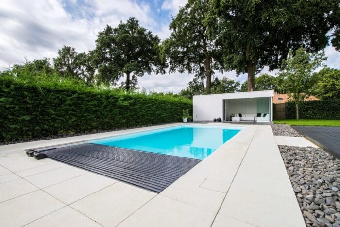 Rectangular in-ground swimming pool with pool house