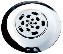 Chrome sink drain strainer sits centered, covering a drain with patterned perforations and small central cross, its reflective polished surface catching highlights against a plain white background.