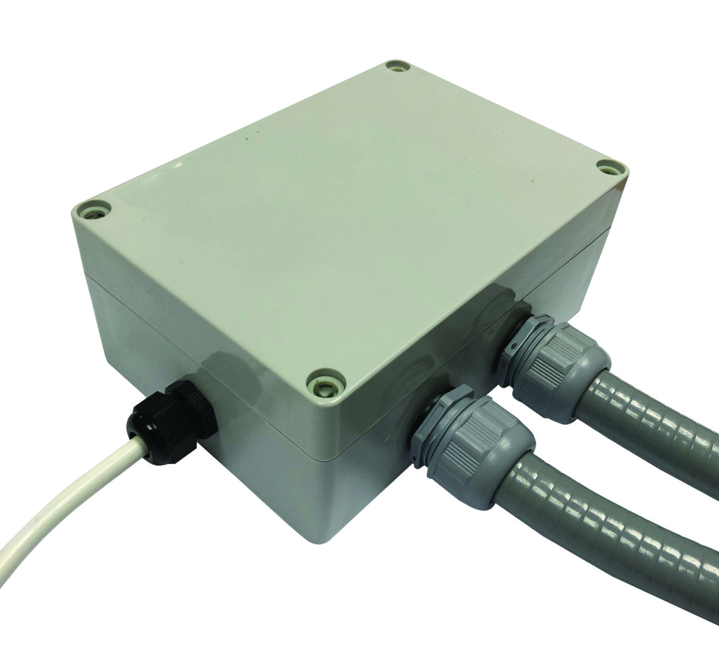 Plastic rectangular electrical junction box sits with three cables attached through threaded cable glands, two gray flexible conduits and a white cable extending from sides, photographed on a white background.