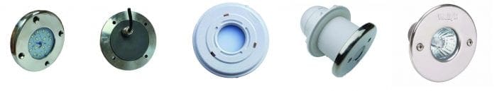 Five circular recessed lights arranged in a row, shown from various angles; stainless steel bezels, glass lenses and white plastic housings visible; photographed against a white background as catalog items
