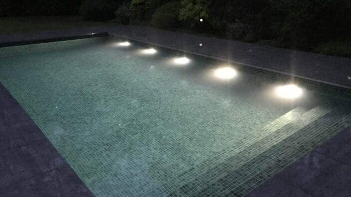 Rectangular pool with gray roller cover