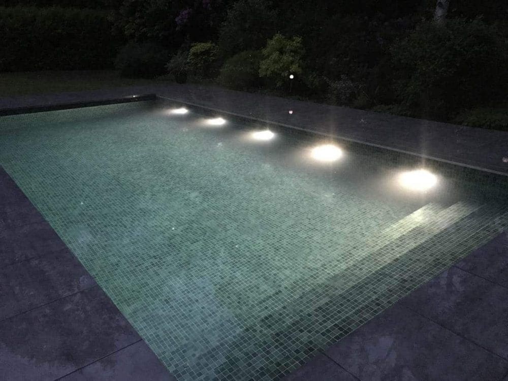 Rectangular pool with gray roller cover