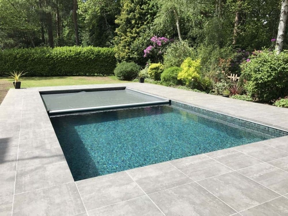 Rectangular pool with gray roller cover