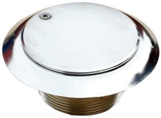 Round polished chrome access cap covers a threaded brass fitting, fastened by a single slotted screw, sitting flush with a flanged rim against a white background.