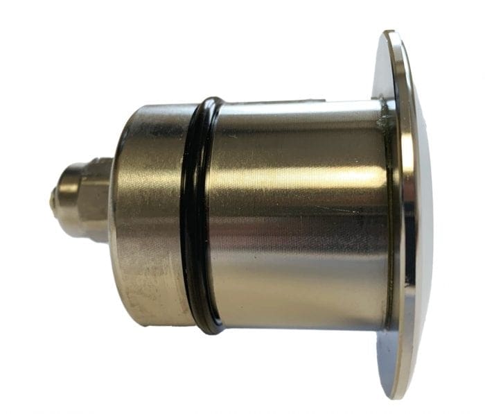 A cylindrical metal cartridge with a flange and two black O-rings rests horizontally, showing a hexagonal connector at one end; photographed against a plain white background.
